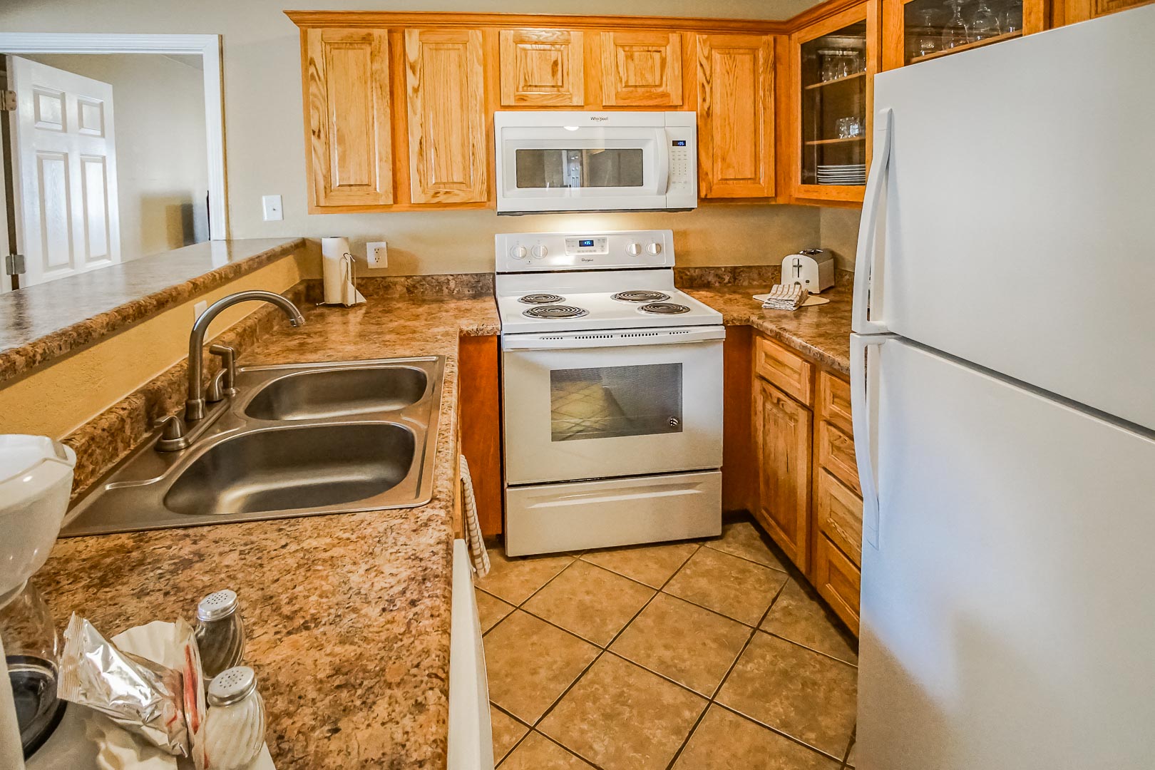A fully equipped kitchen at The Townhouses Resort in Branson, Missouri.